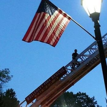 Fireman on Ladder with Flag