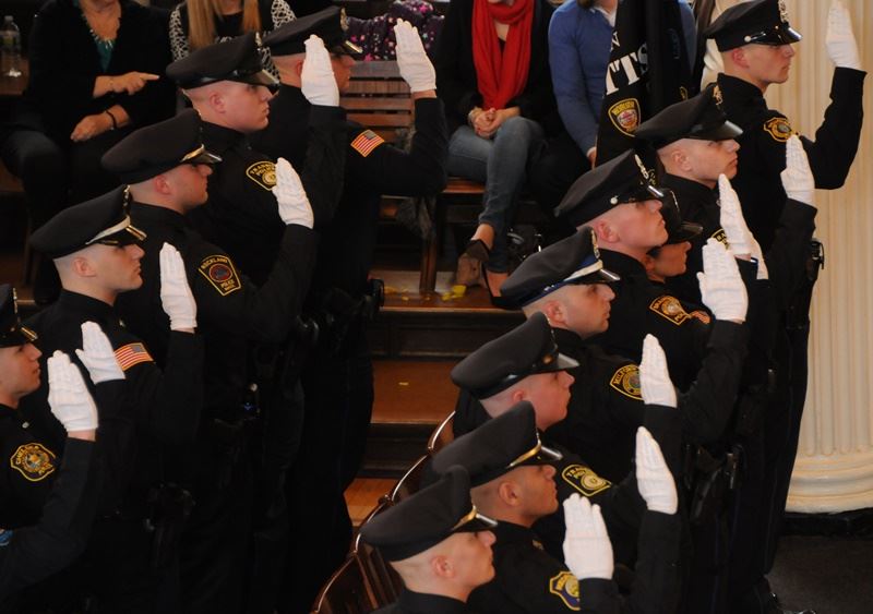 Police officers being sworn into office