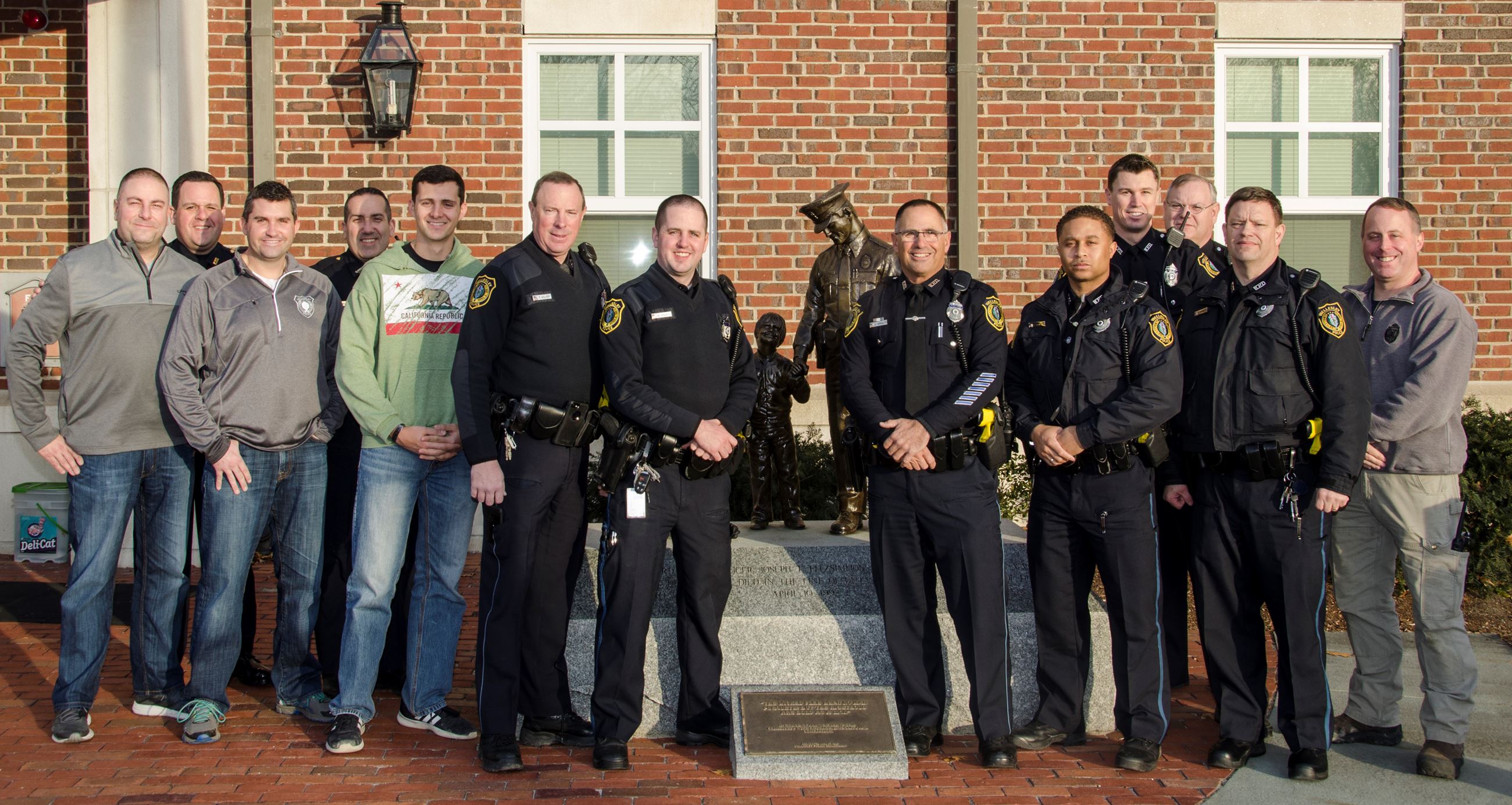 Officer Amalfi stands with the midnight and day shift...and some midnight alums...on his last shift.