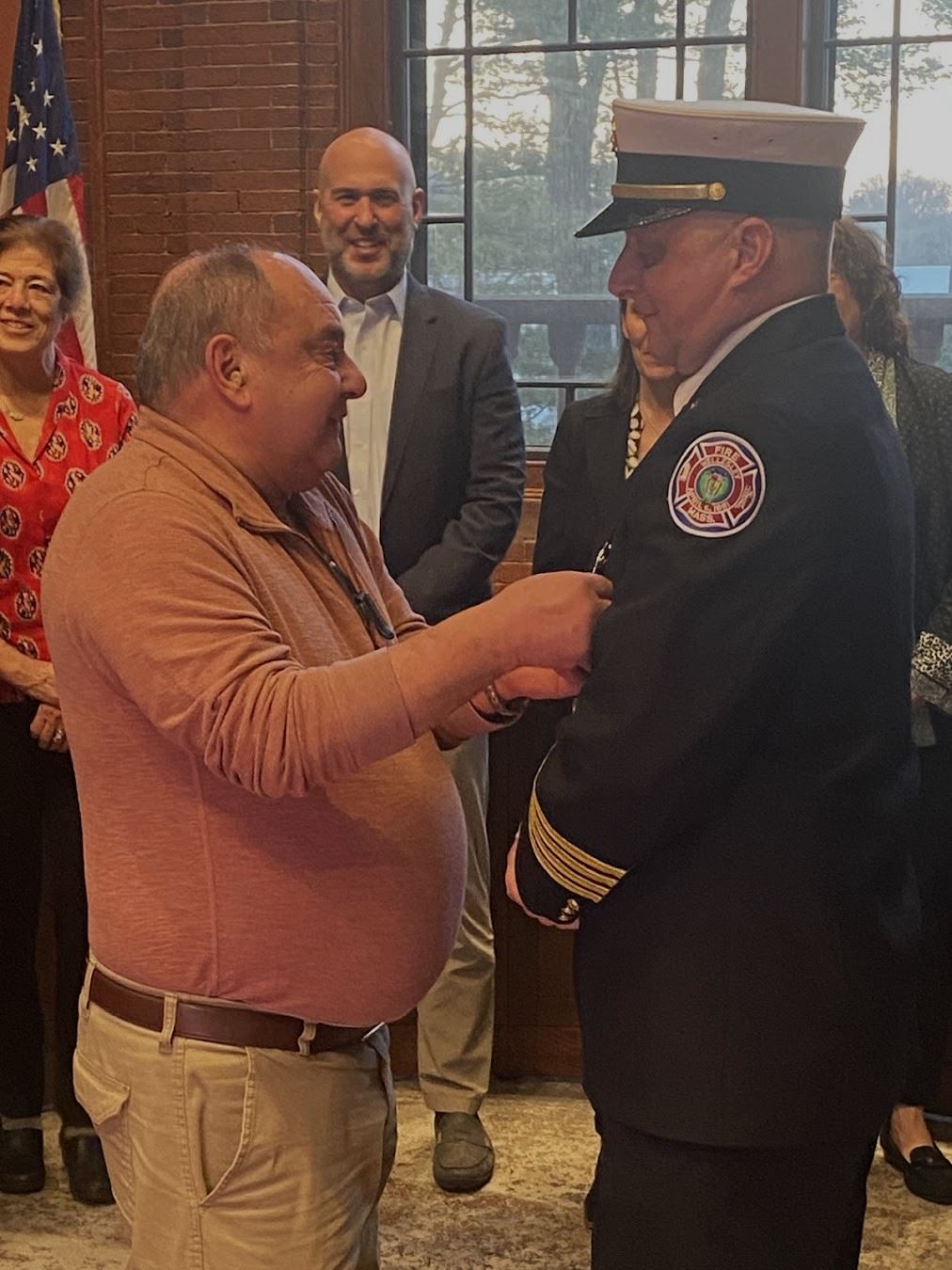 Chuck DiGiandomenico and father. badge pinning