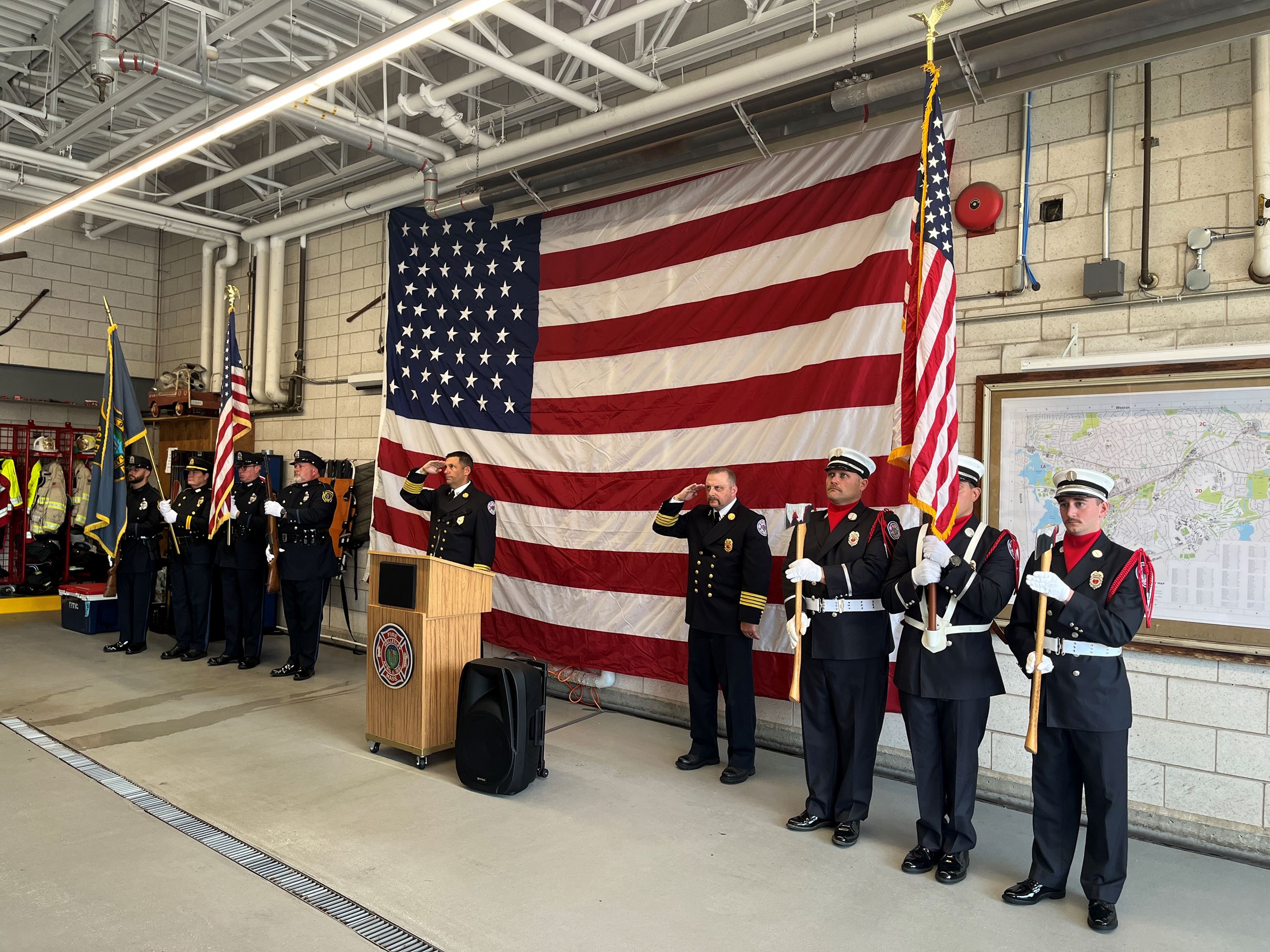 Wellesley Police Department and Fire Department honor guards and staff saluting at 9/11 ceremony